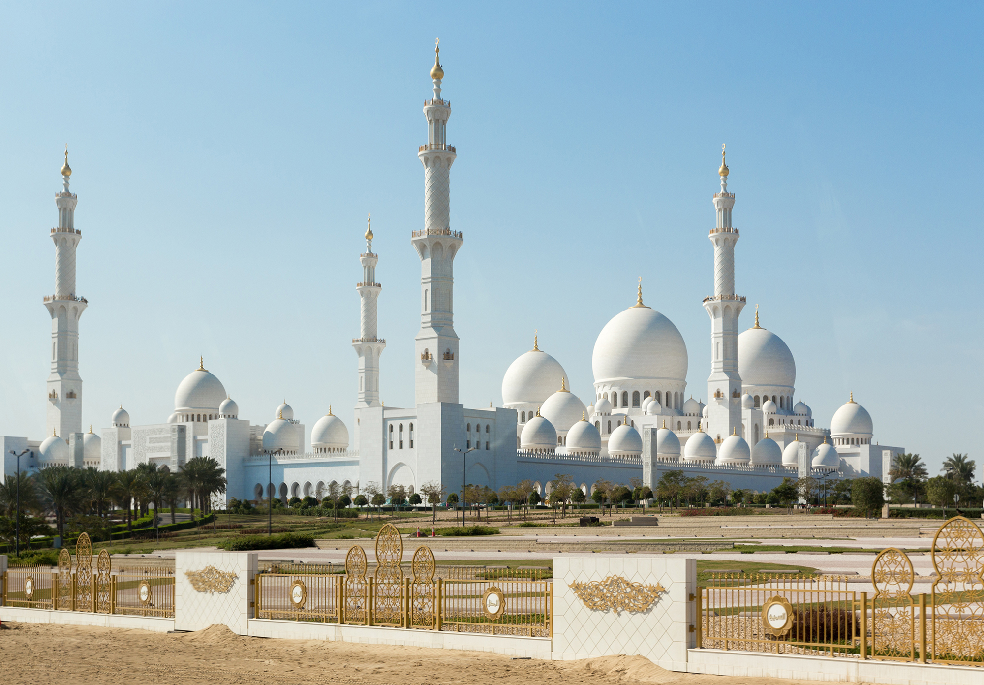 picture of the front of a white mosque in abu dhabi
