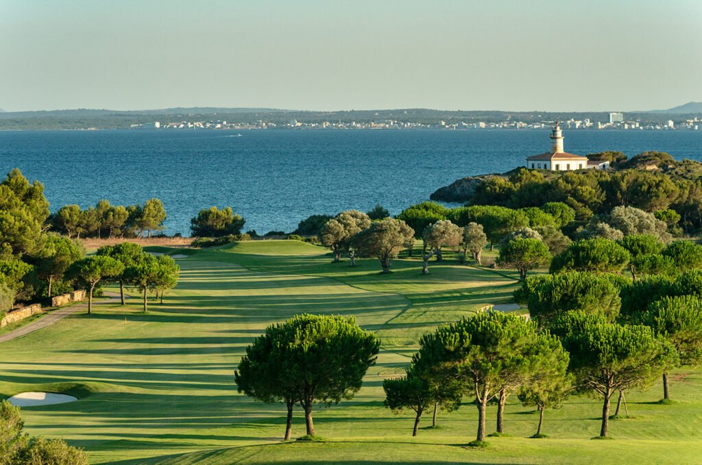 Fairway with trees and lakes around at Alcanada Golf Club