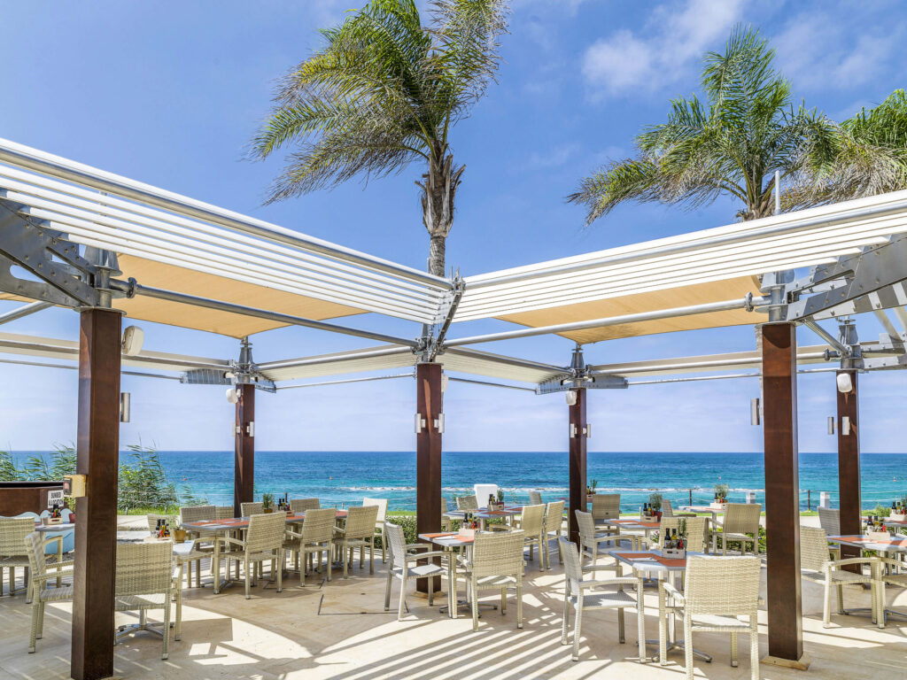 Outdoor dining at Alexander The Great Beach Hotel