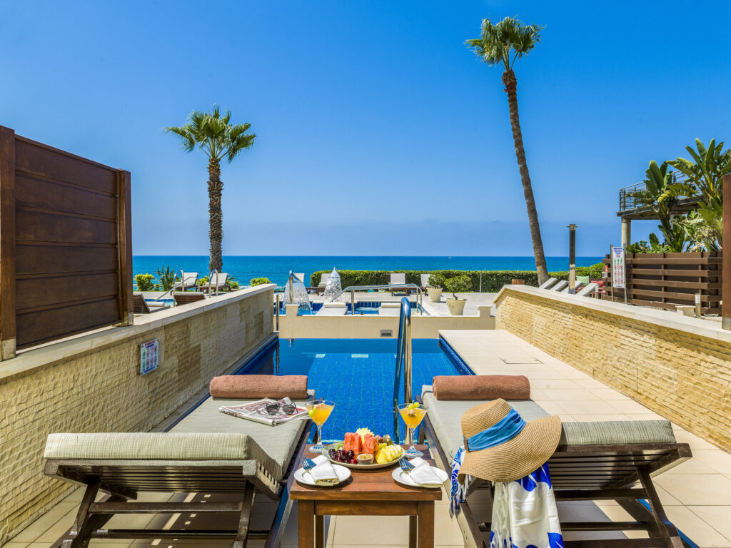 Loungers by accommodation private pool at Alexander The Great Beach Hotel