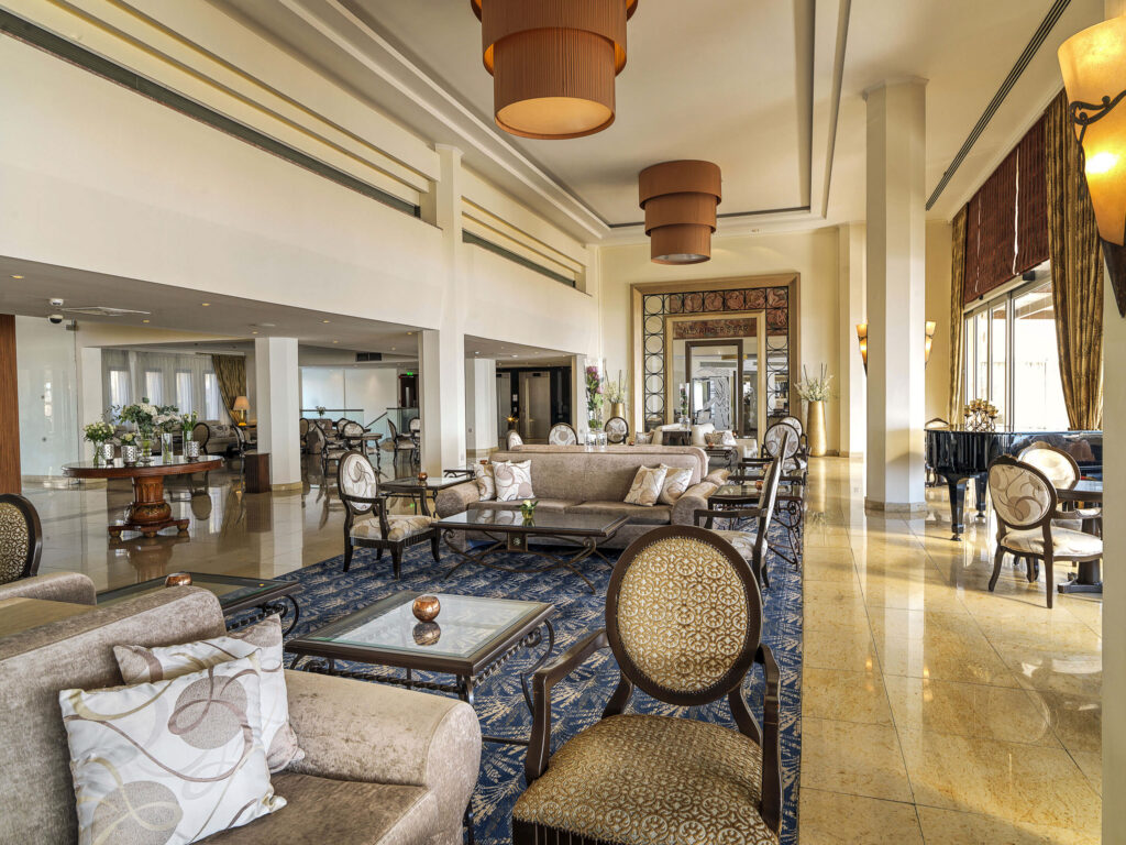 Communal indoor seating area at Alexander The Great Beach Hotel