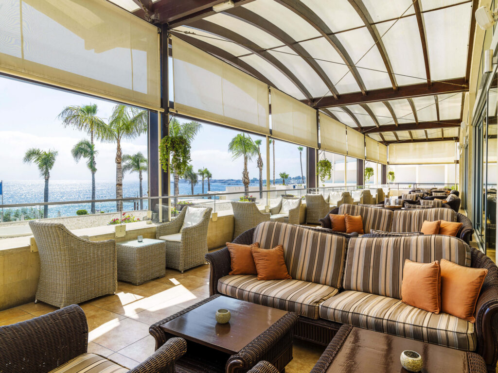 Indoor seating area at Alexander The Great Beach Hotel