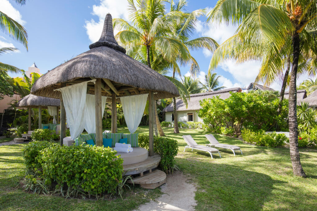 Sun loungers in the gardens at Ambre Resort on Mauritius