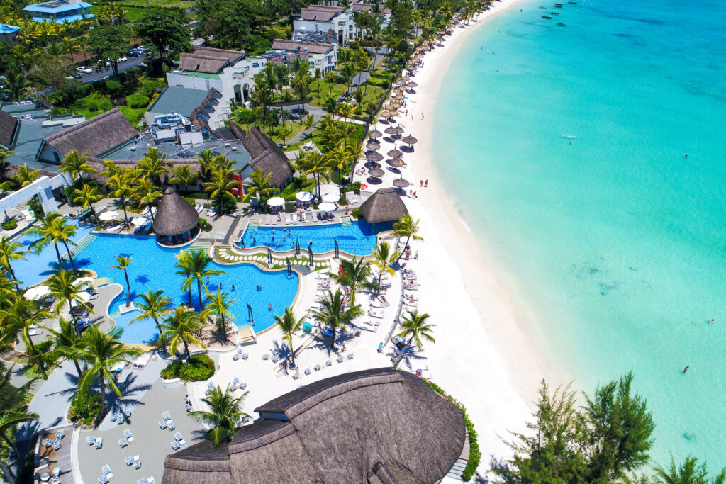 Aerial view of the white sandy beach and blue sea at Ambre Resort in Mauritius