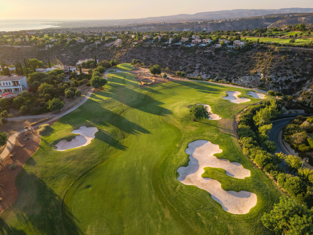 Bunkers on fairway at Aphrodite Hills PGA National Cyprus with villas and hills around