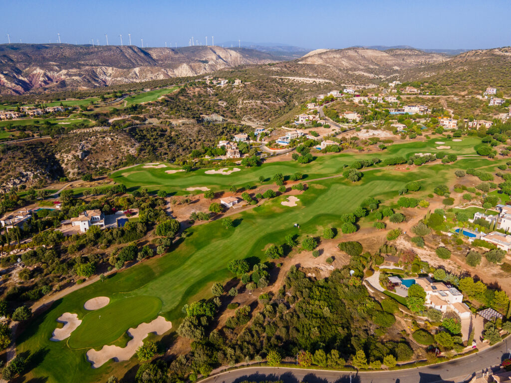 Aerial view of Aphrodite Hills PGA National Cyprus with hills in background