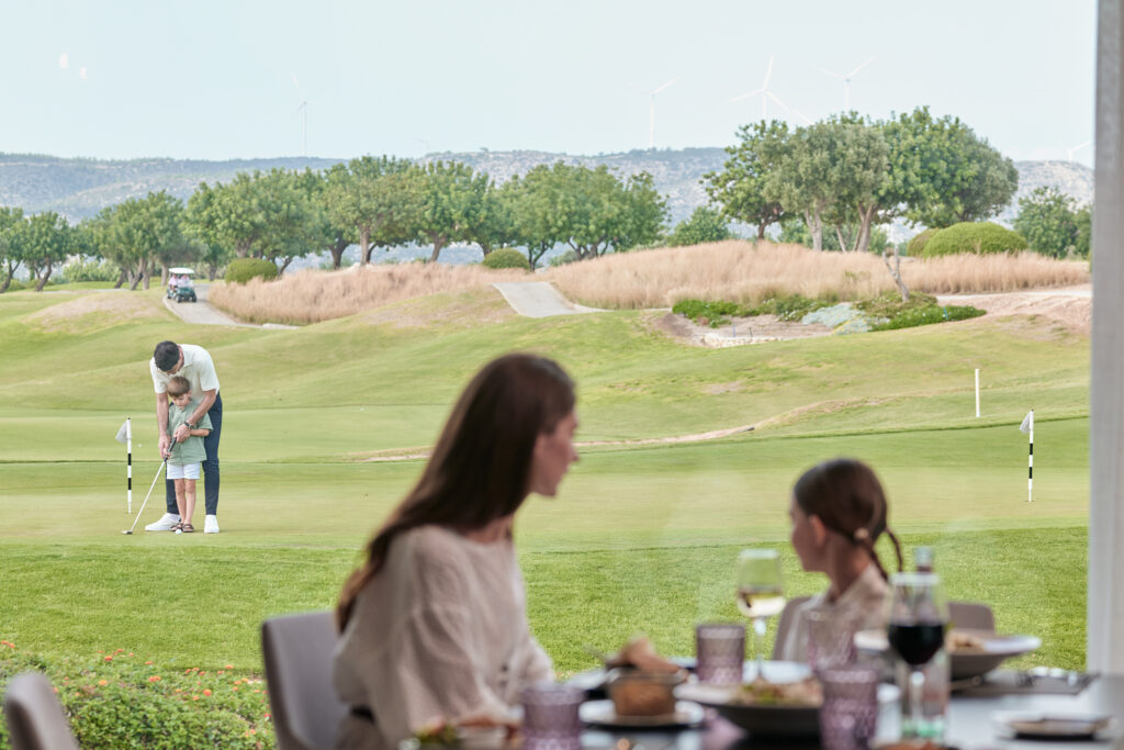 People playing golf at Aphrodite Hills Rentals