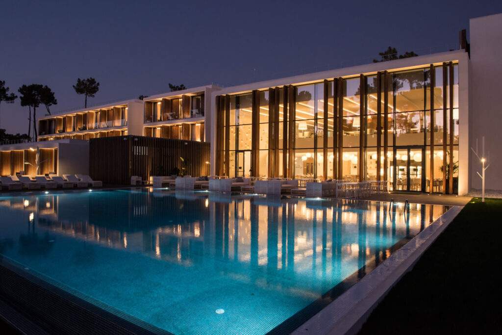 Exterior of Aroeira Lisbon Hotel Sea and Golf Resort with outdoor pool at night
