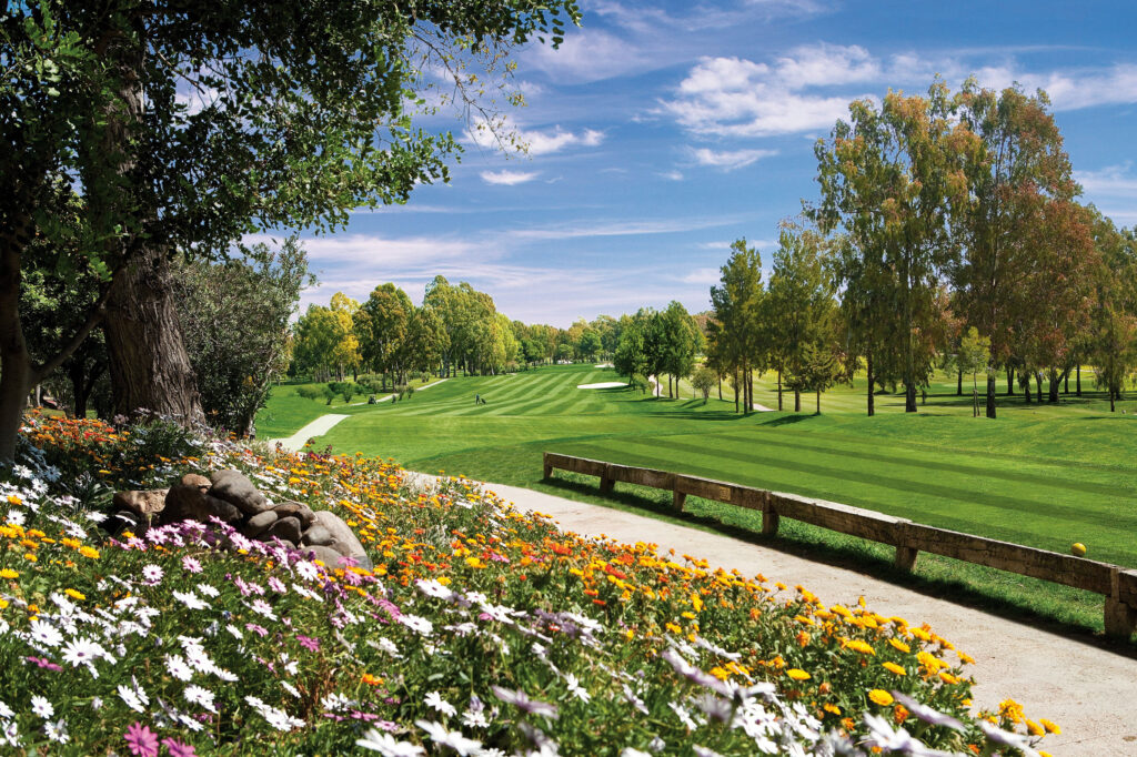 Flowers and trees by path through Atalaya - Old Golf Course