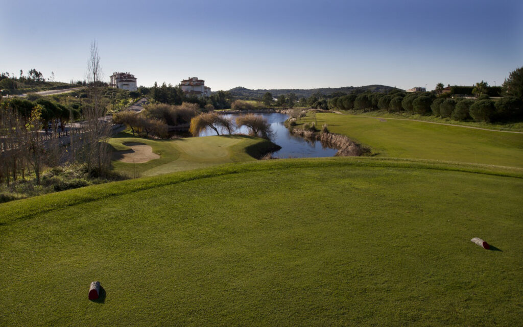 Tee box overlooking a lake on the fairway at Belas Clube de Campo Golf Course