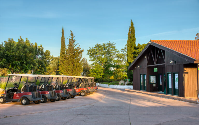 Clubhouse with golf buggys at Benamor golf course