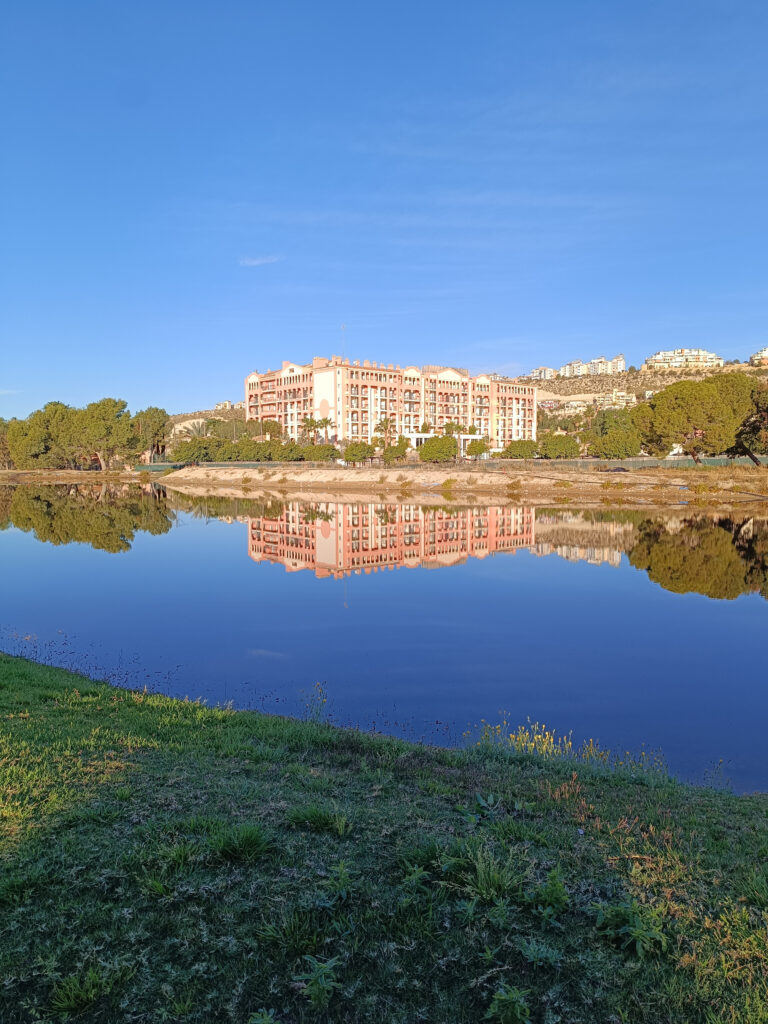 Exterior of Bonalba Golf Resort with lake in foreground