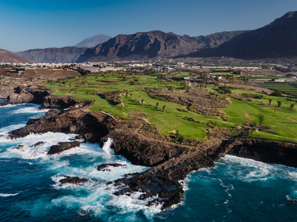 Aerial view of fairway with ocean view and mountains in distance at Buenavista Golf Course