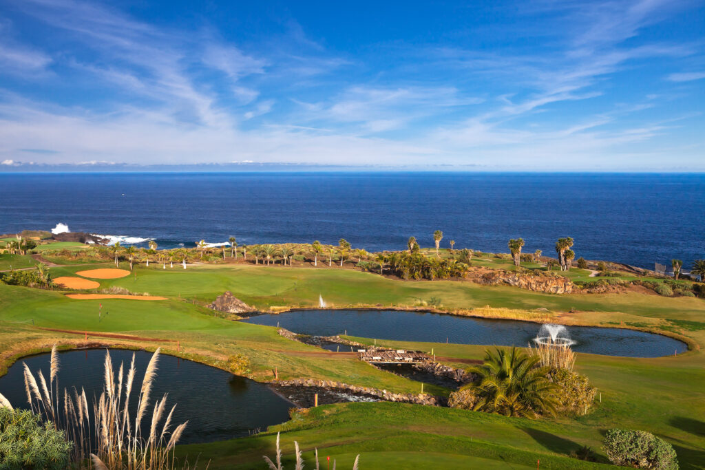 Lakes on fairway with trees around at Buenavista Golf Course with ocean view