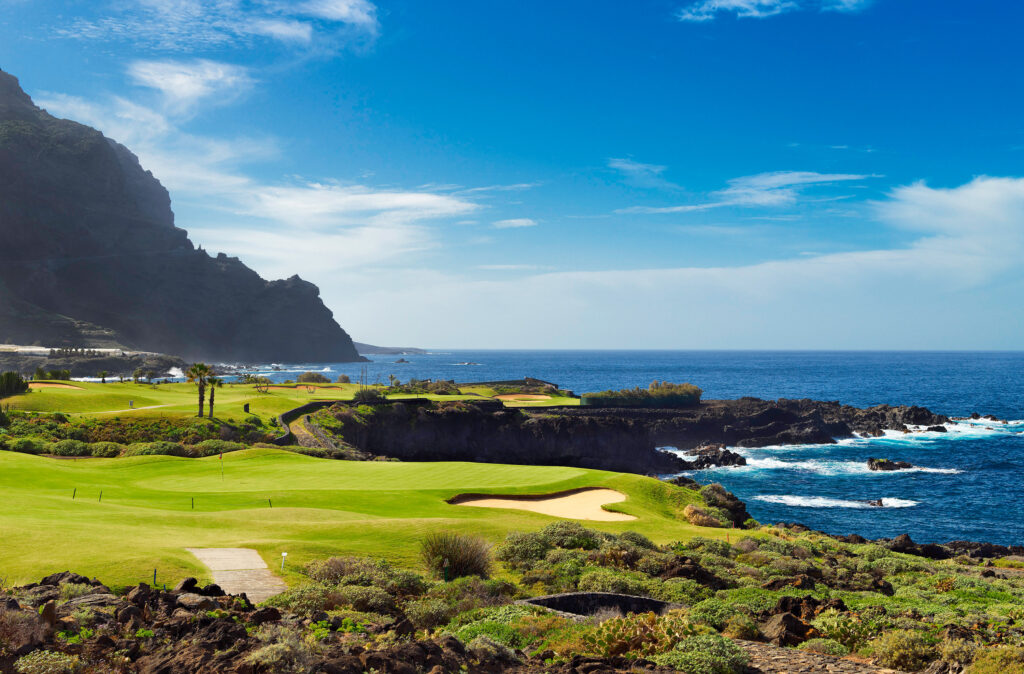 Fairway with bunker and hole with ocean view at Buenavista Golf Course