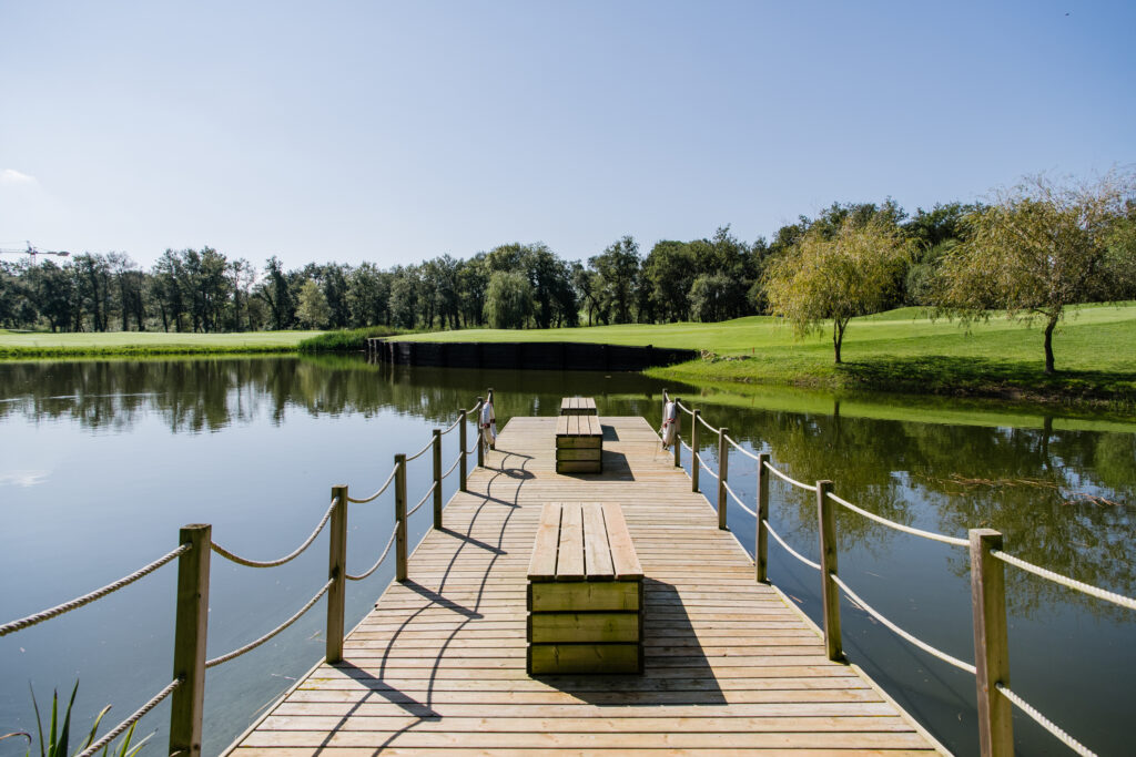 Deck on lake at Camiral Golf & Wellness