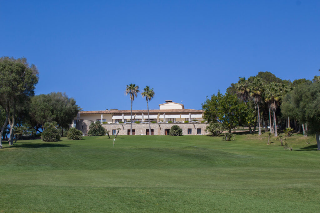 Fairway with building in background at Canyamel Golf Course