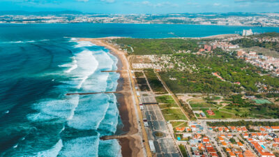 aerial picture of caparica town with the beach