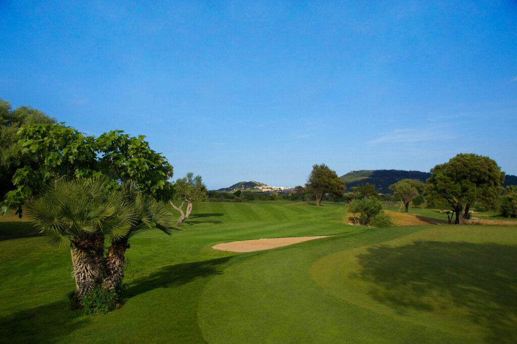 Fairway with bunker and trees at Capdepera Golf Course