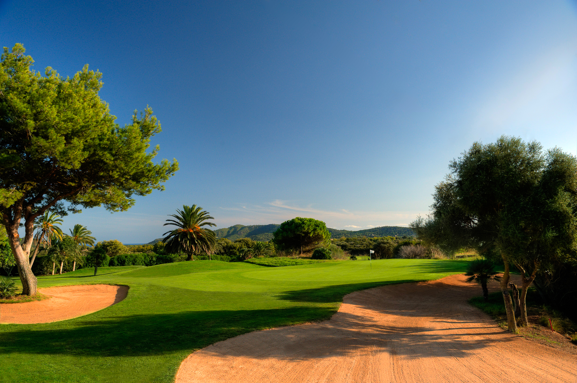 Bunkers on fairway with trees around at Capdepera Golf Course