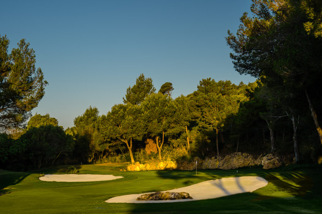 Bunkers on fairway with trees around at Capdepera Golf Course