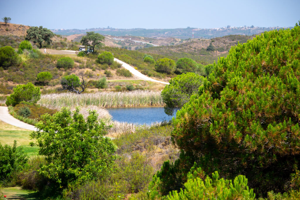 Lake with trees and shrubbery around at Castro Marim golf course