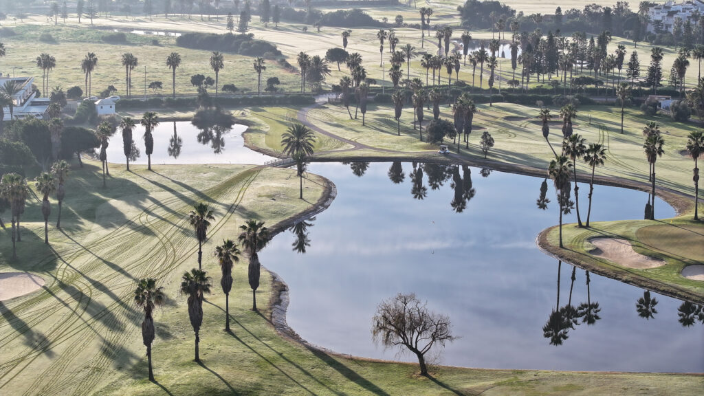 Aerial view of Costa Ballena Ocean Golf Club with lakes and trees