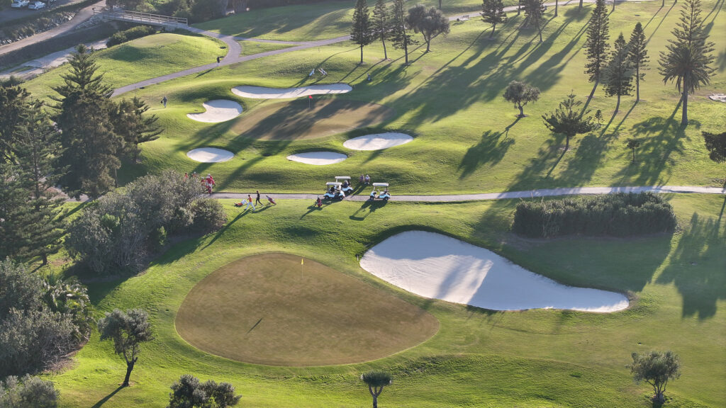 Aerial view of Costa Ballena Ocean Golf Club with bunkers and buggies in view