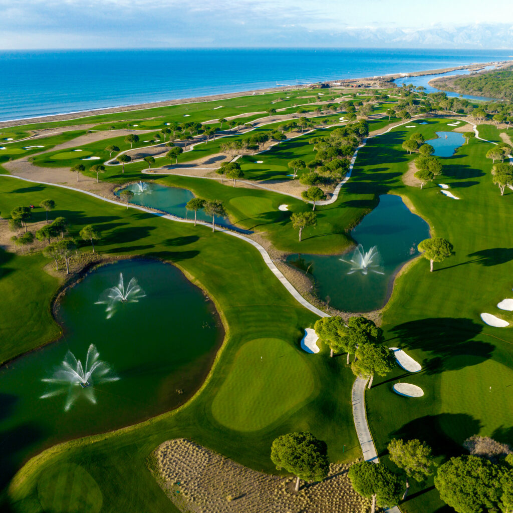 Aerial view of Cullinan - Olympos Golf Course with fountains on the lakes