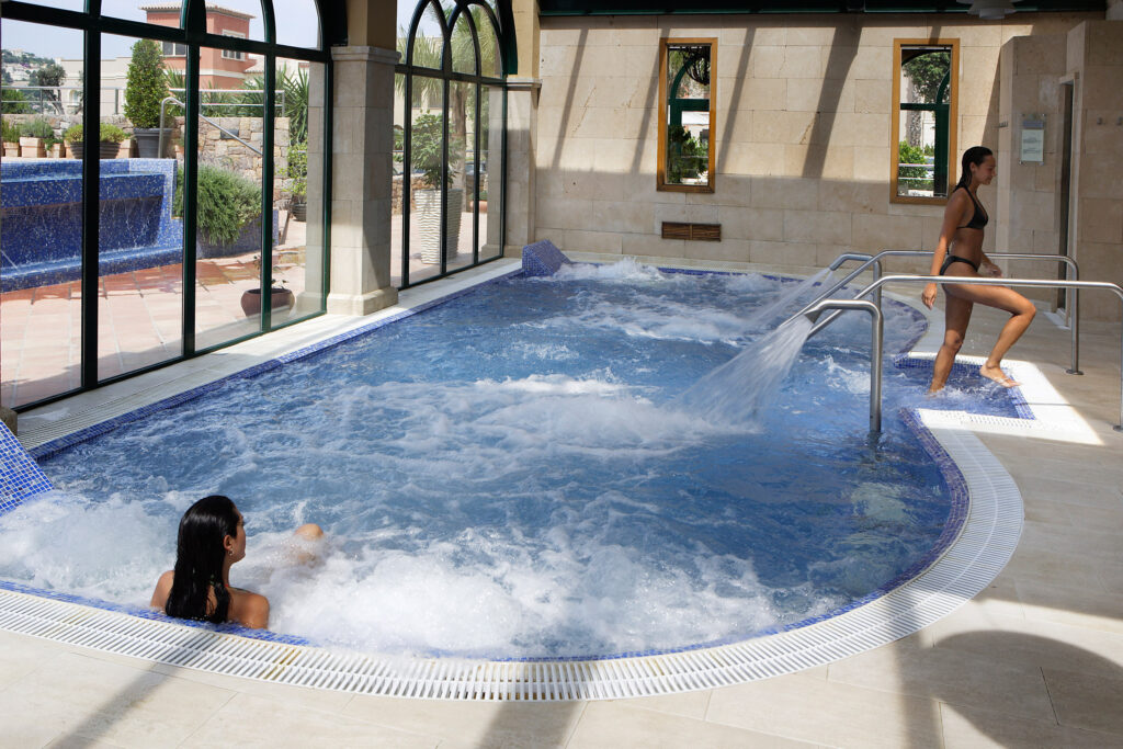 Women relaxing in the indoor pool at Denia La Sella Golf Resort & Spa