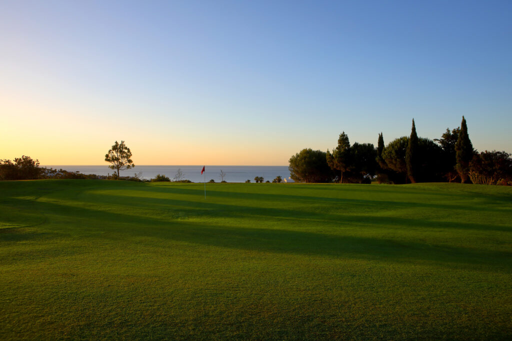 Hole with red flag at Dona Julia Golf Course