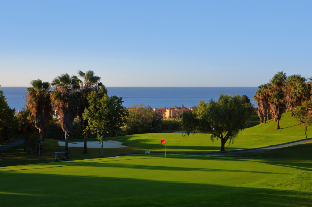 Hole with red flag at Dona Julia Golf Course