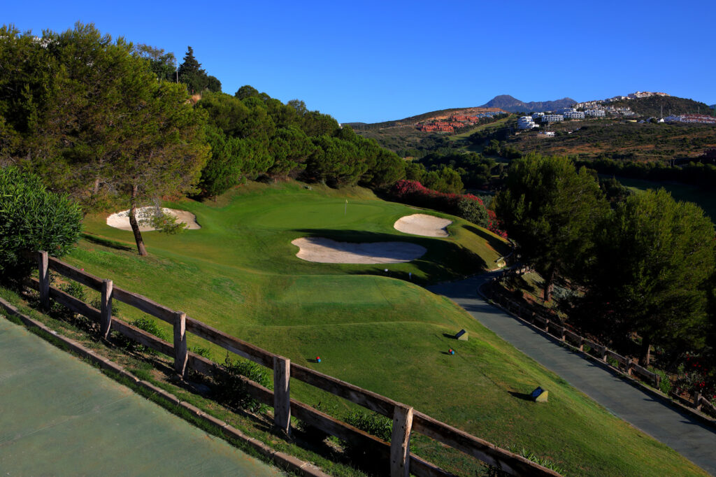 Hole with bunkers and trees around at Dona Julia Golf Course