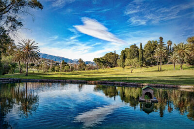 Lake with fairway and trees in background at El Paraiso Golf Course