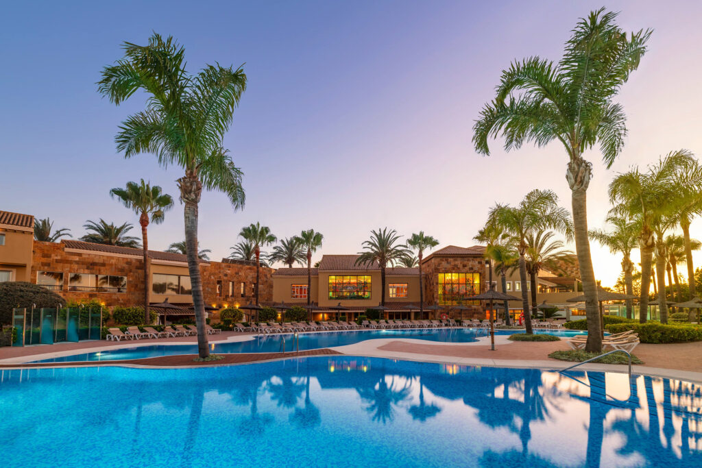 Outdoor pool at sunset at Elba Costa Ballena