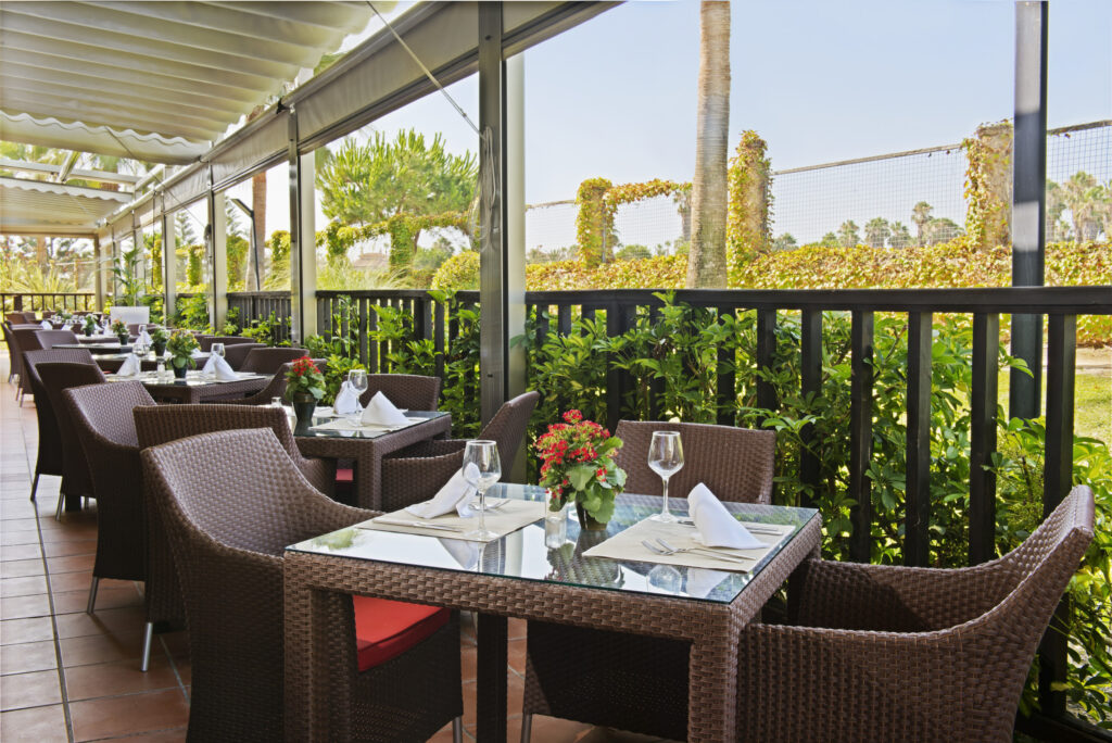 Dining on a patio at Elba Costa Ballena