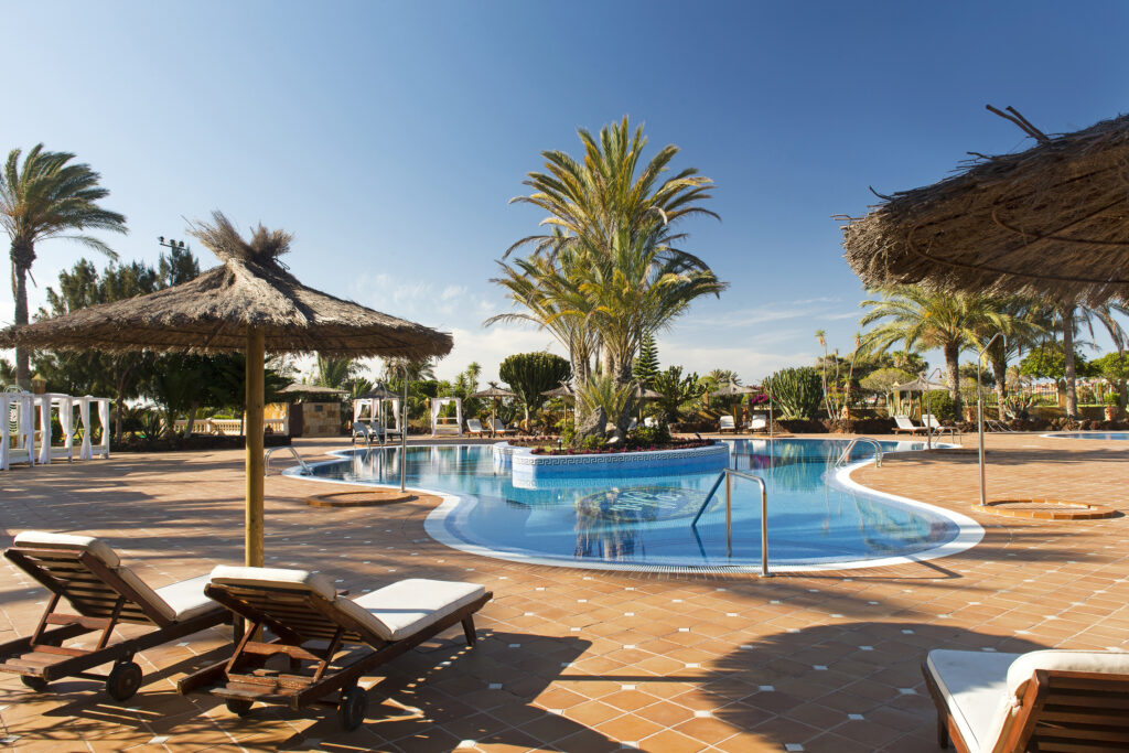 Elba Palace Golf Boutique Hotel outdoor swimming pool and lounge area