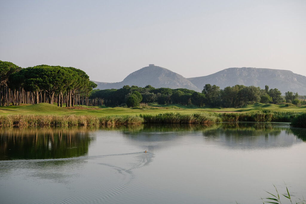 Lake with fairway and trees in background at Emporda - Links Course