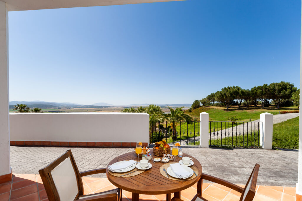 Patio with dining table for two at Fairplay Golf & Spa Resort