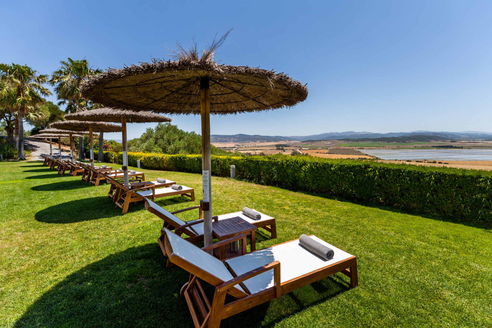 Sun loungers with umbrellas with a view at Fairplay Golf & Spa Resort