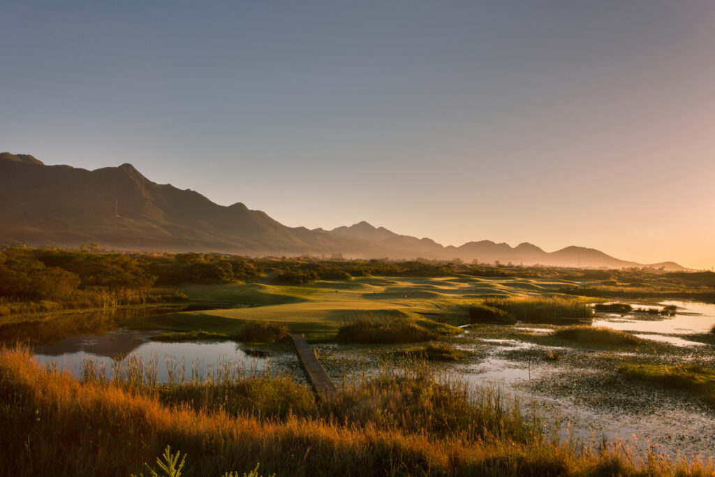 Fairway at Fancourt Hotel with lake and mountains in background