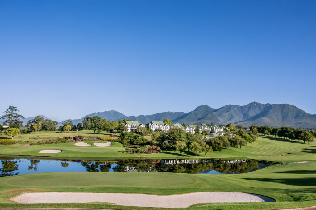 Hole with bunkers and lake in background at Fancourt - Montaguwith buildings in background