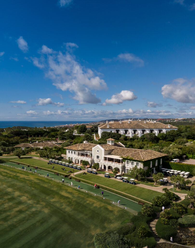 Aerial view of driving range and clubhouse at Finca Cortesin Golf Course