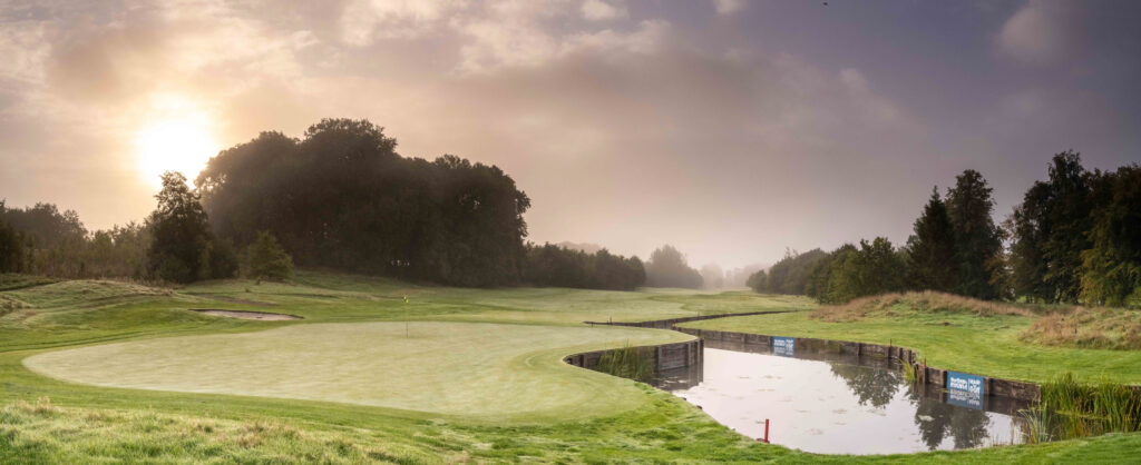 Hole with trees around and water hazard at Galgorm Championship Course