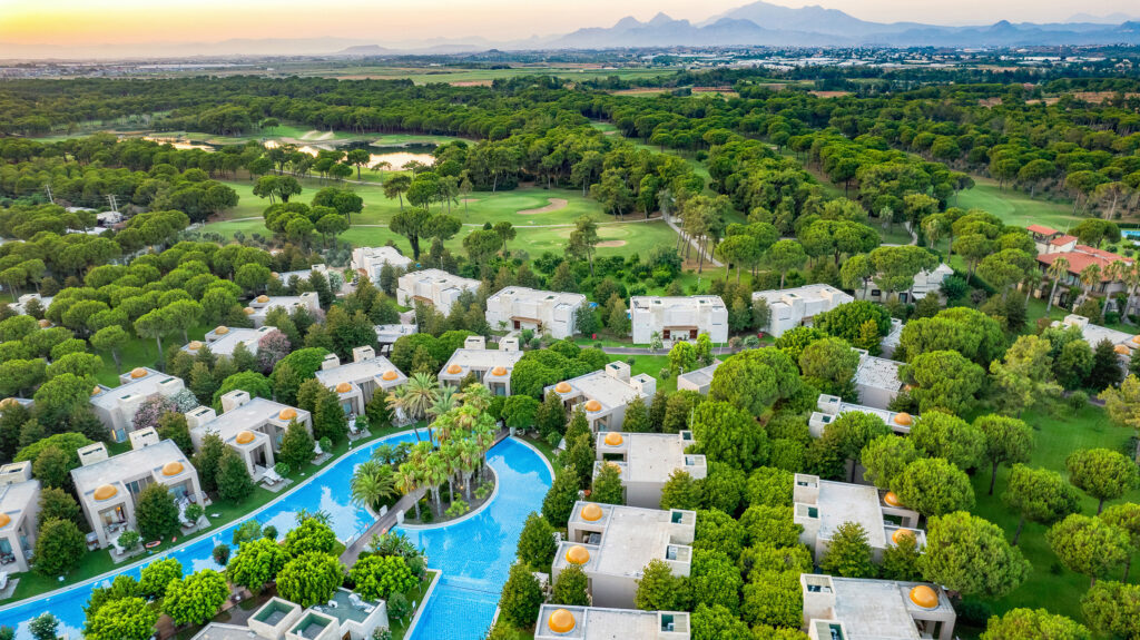 A overhead view of the Gloria Serenity Resort. The view captures the rooms with a private pool below, an the fantastic gloria golf club surrounding the resort.