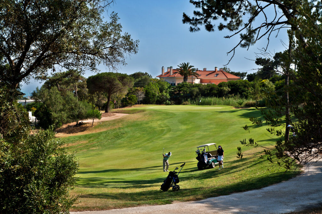 People playing golf with buggy at Golf do Estoril Golf Course