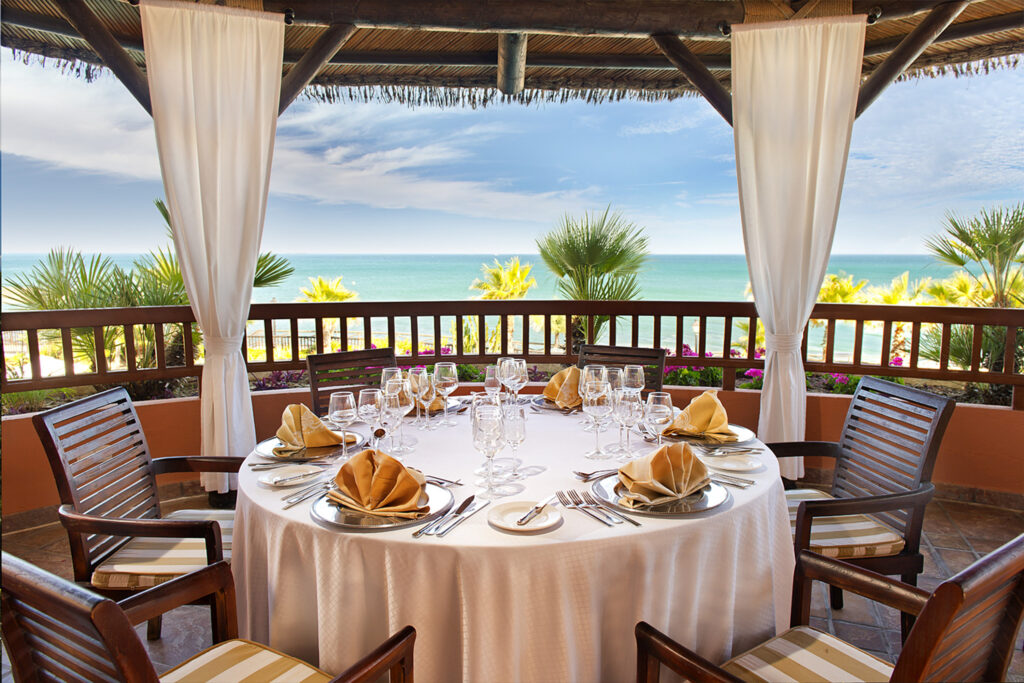 Outdoor dining with beach view at Gran Hotel Elba Estepona