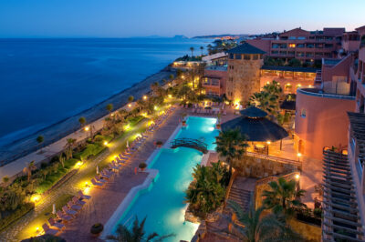 Outdoor pool at night at Gran Hotel Elba Estepona