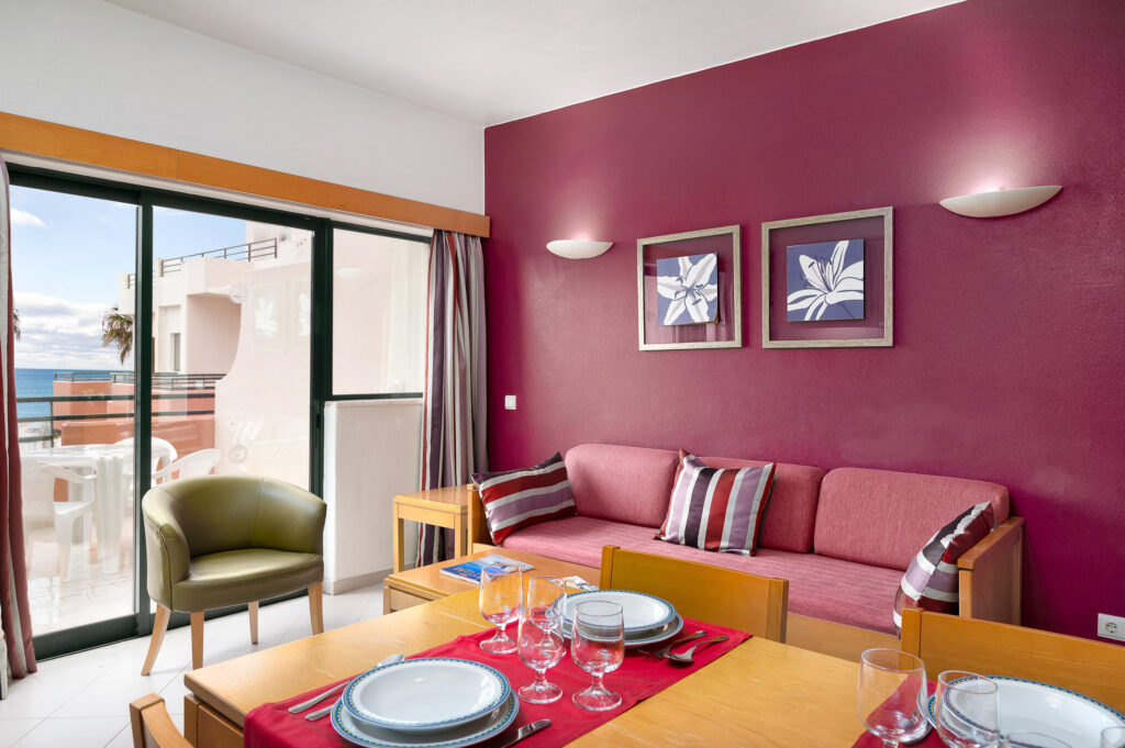 Dining and living area in accommodation at Grand Muthu Forte Da Oura