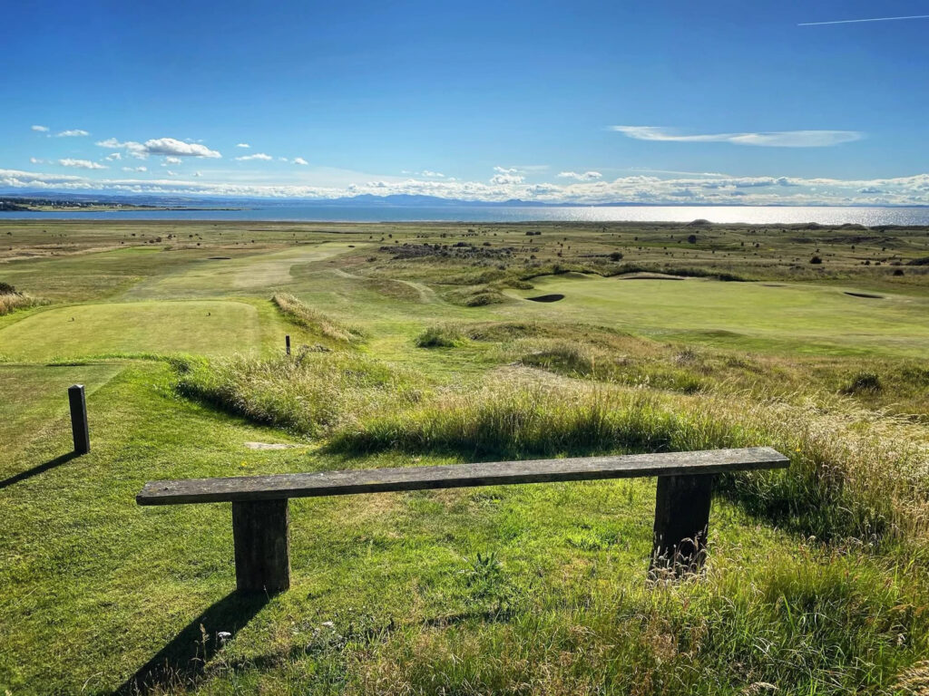 Bench next to tee box at Gullane Golf Club - No. 2 Course overlooking fairway